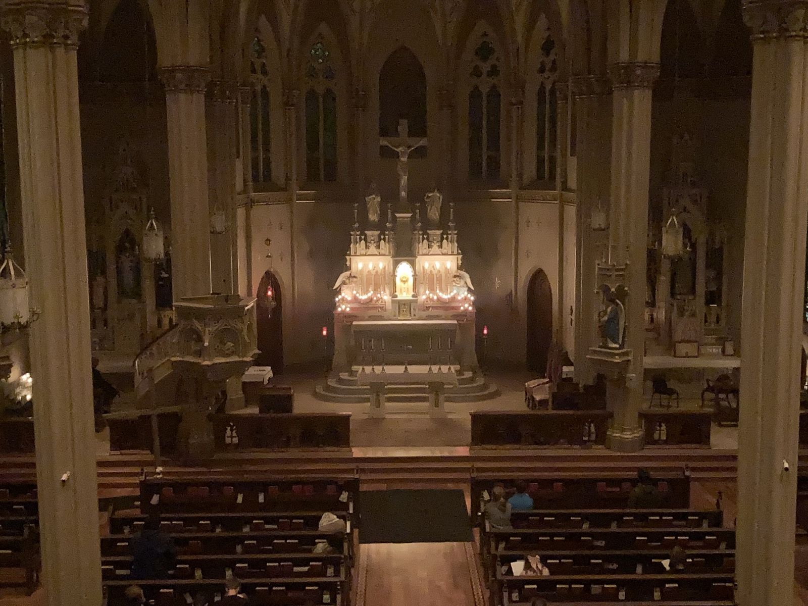The interior of the parish church with the altar lit