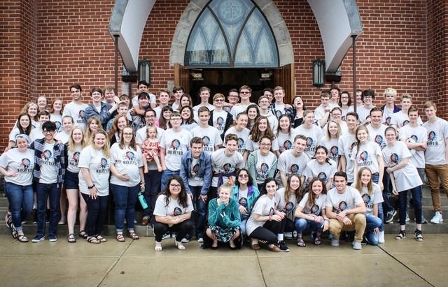 The Antioch group gathered together on the steps of the parish church